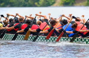 Team of people in dragon boat