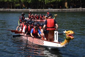 Team in dragon boat race on the water